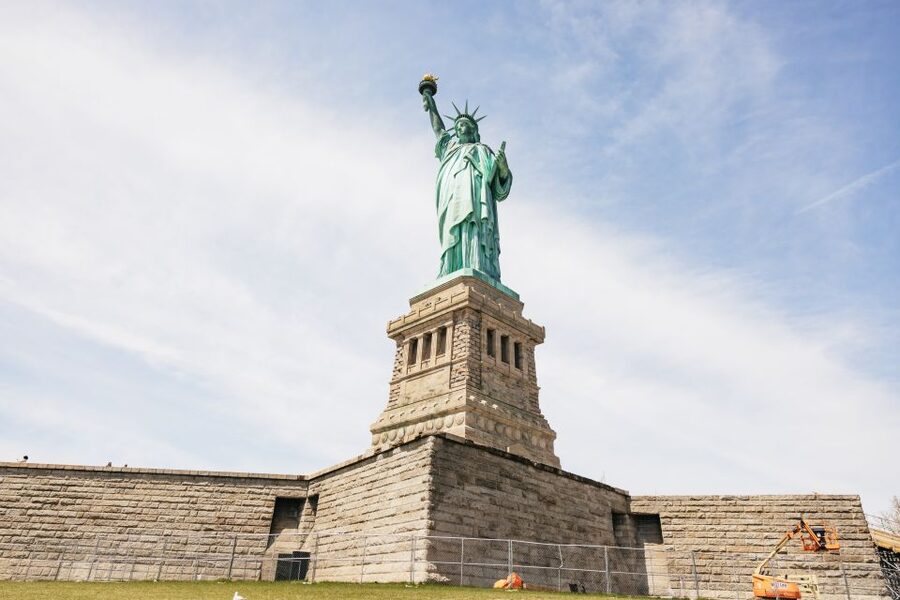 NYC: Wall Street Tour with 9/11 Memorial and Statue Ferry - Charging Bull and the stories behind the photo stop