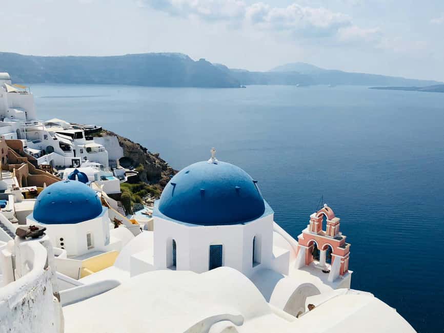 Santorini Guided Day Trip From Crete with Ferry Tickets - Oia: blue domes, cliff paths, and limited time